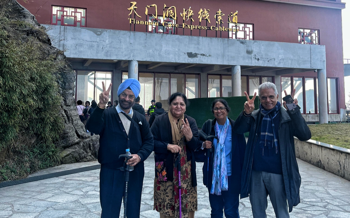 Dr Pasricha and his family were in front of the entrance building for Tianmen Mountain Cableway, Zhangjiajie